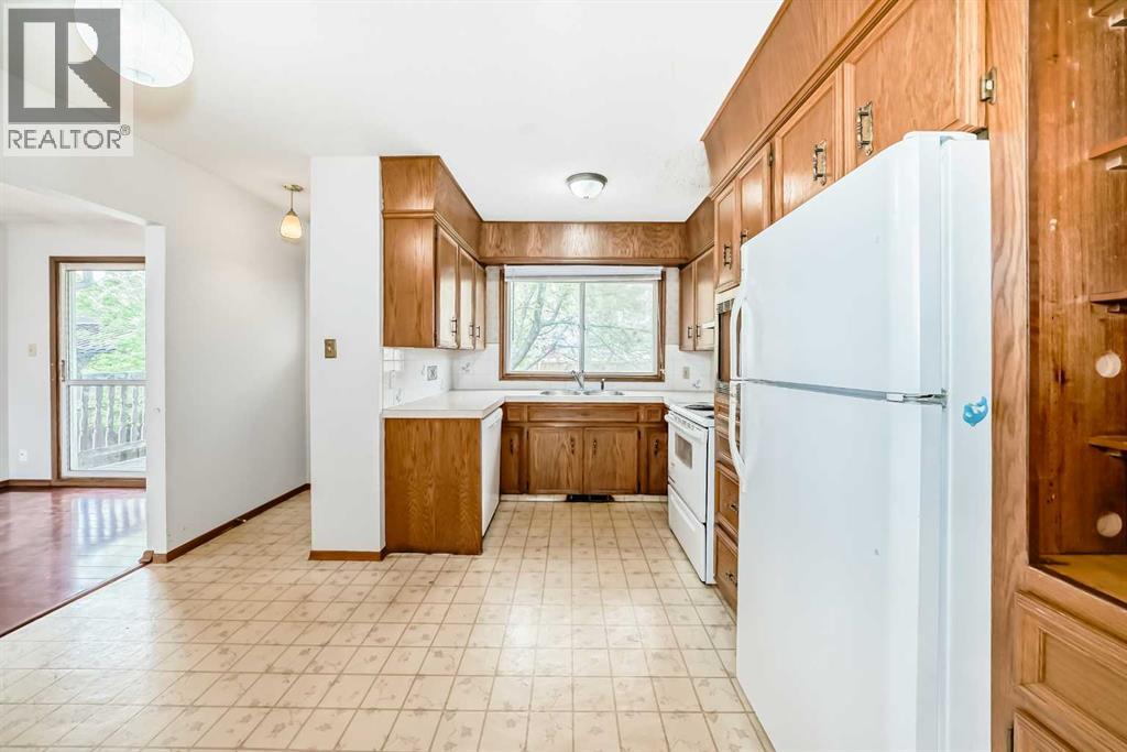 Single Family House Bi-level for Sale in  Barron Drive NW Brentwood Calgary 