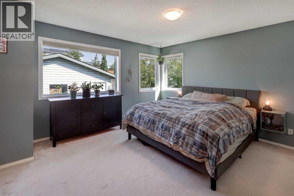 Single Family House Bi-level for Sale in  Arbour Grove Close NW Arbour Lake Calgary 
