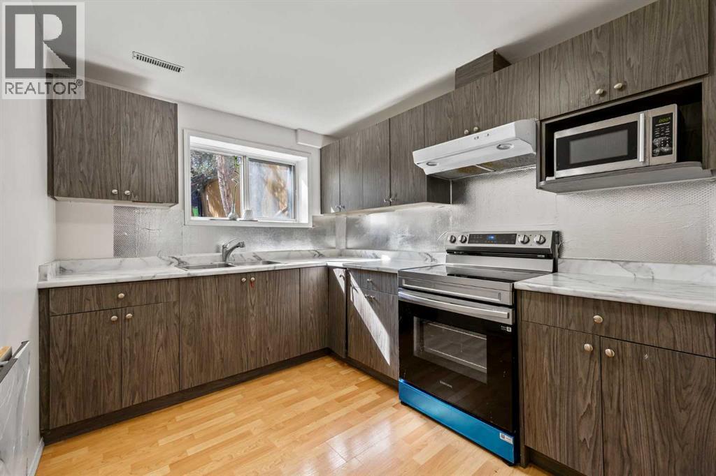 Single Family House Bi-level for Sale in   Avenue NE Pineridge Calgary 