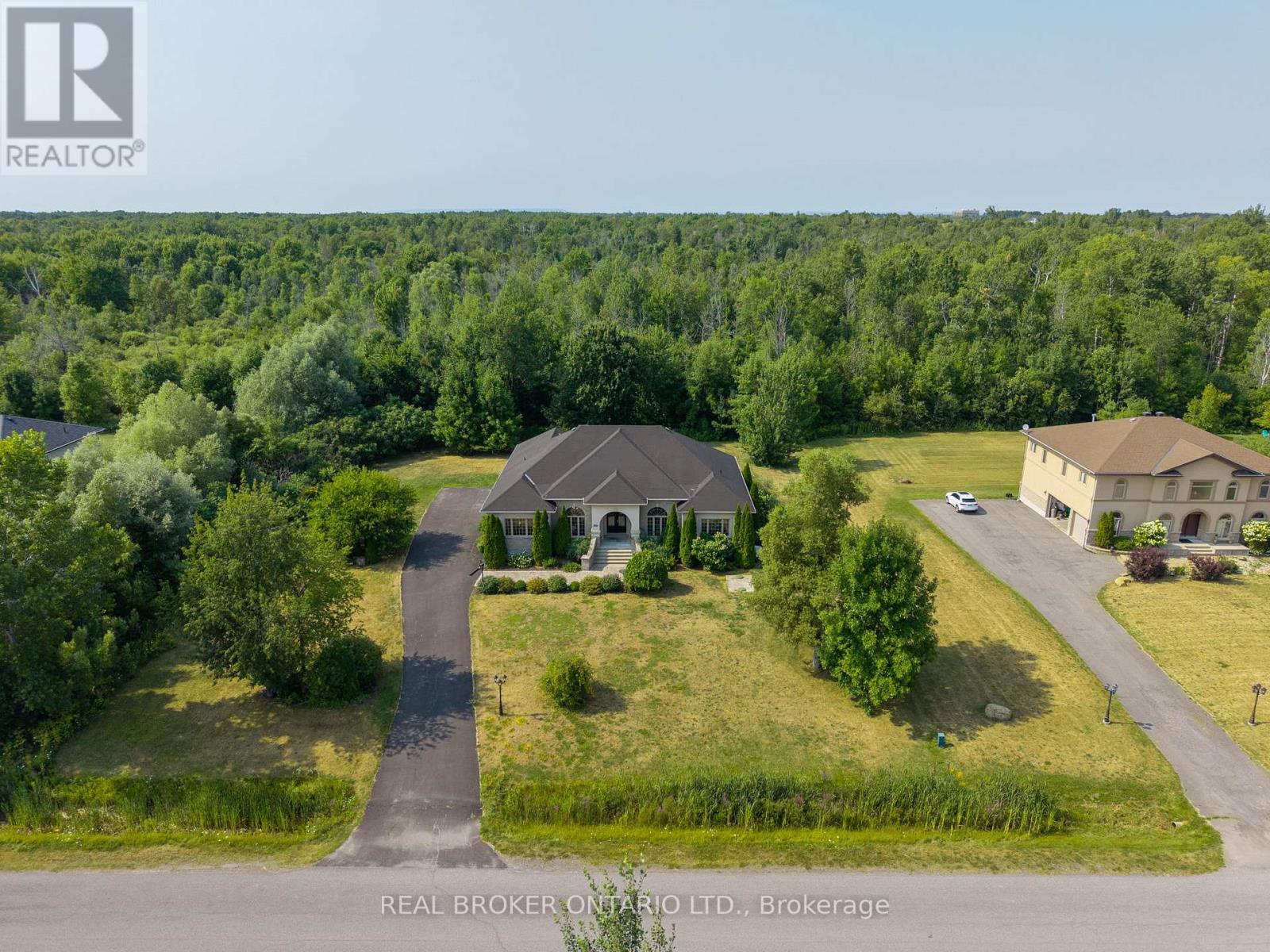 Private 3/4-acre lot backing onto forest