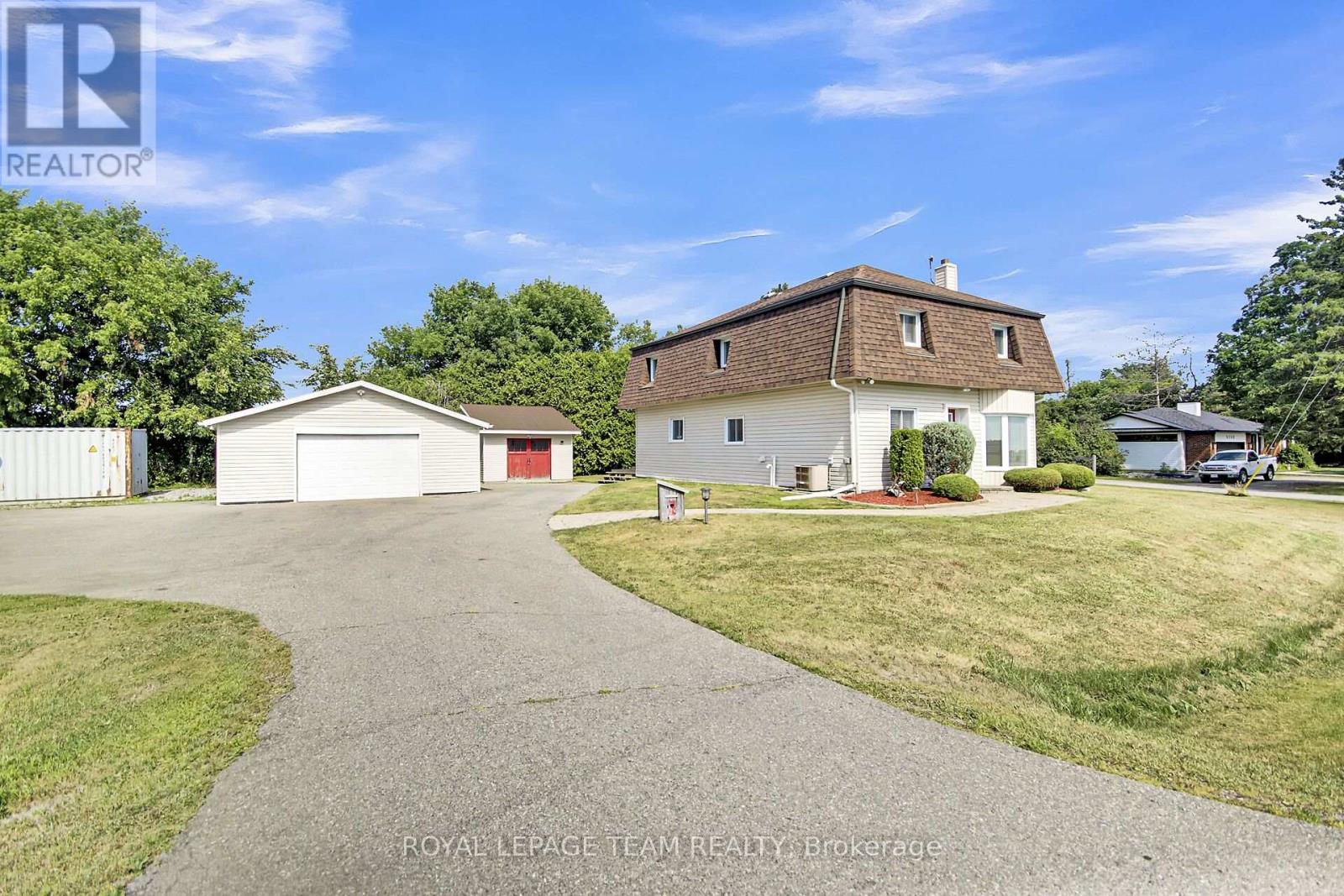Detached double Garage & tons of parking for more!