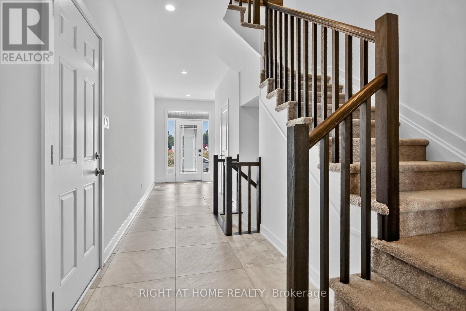 Bright spacious entryway, closet & powder room.