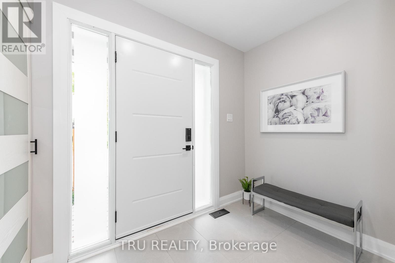 Inside shared entry with a beautiful stone tile.