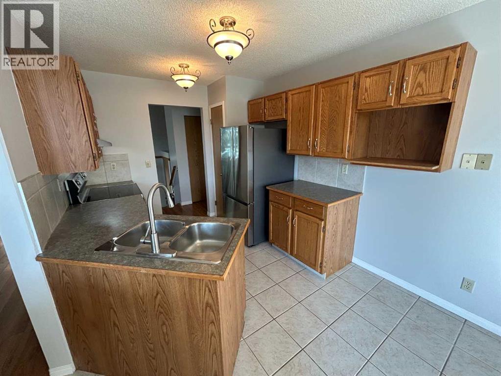 Single Family House Bi-level for Sale in  Millrise Close SW Millrise Calgary 
