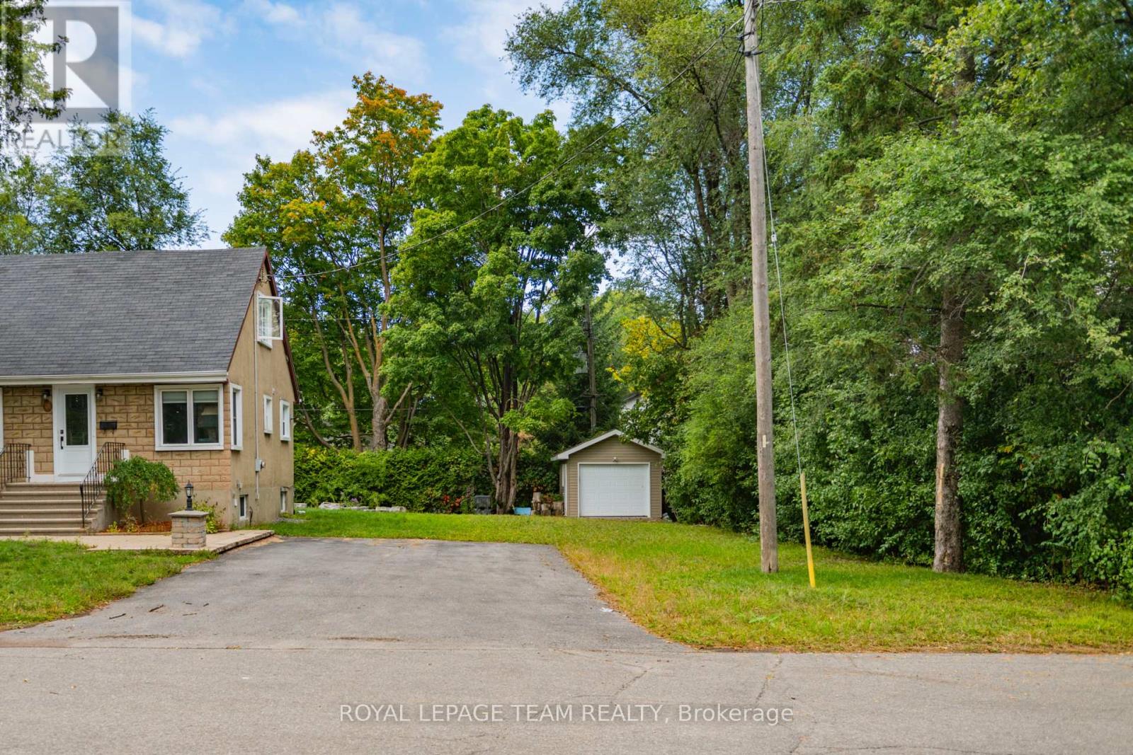 Shed is wired, insulated, auto garage door.