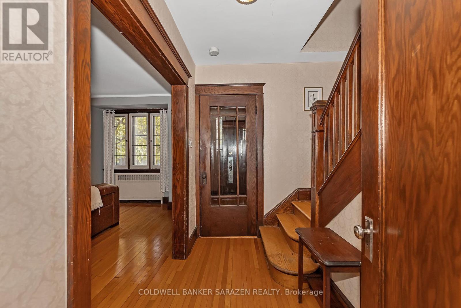 Front hallway - hardwood floors - original trim