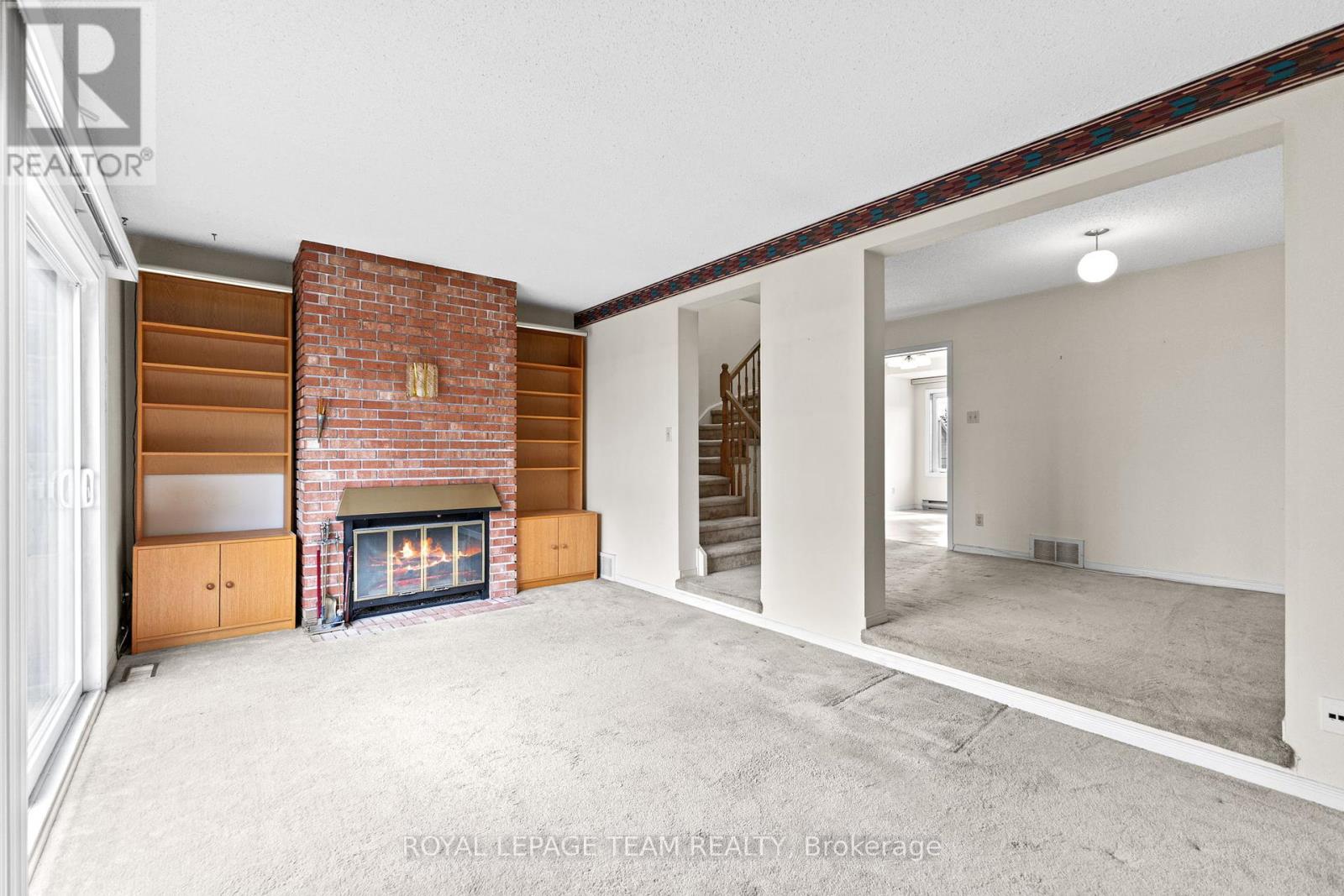 Living room with wood burning fireplace