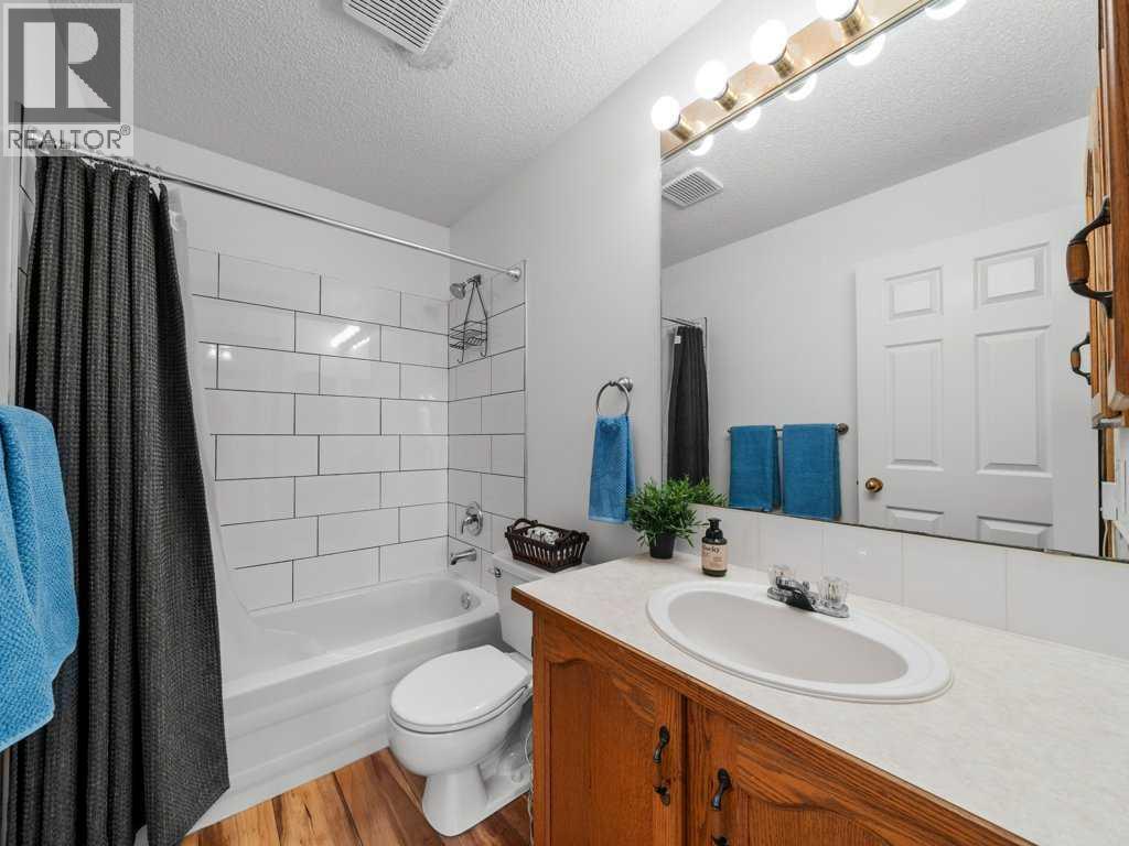 Single Family House Bi-level for Sale in  Arbour Stone Rise NW Arbour Lake Calgary 