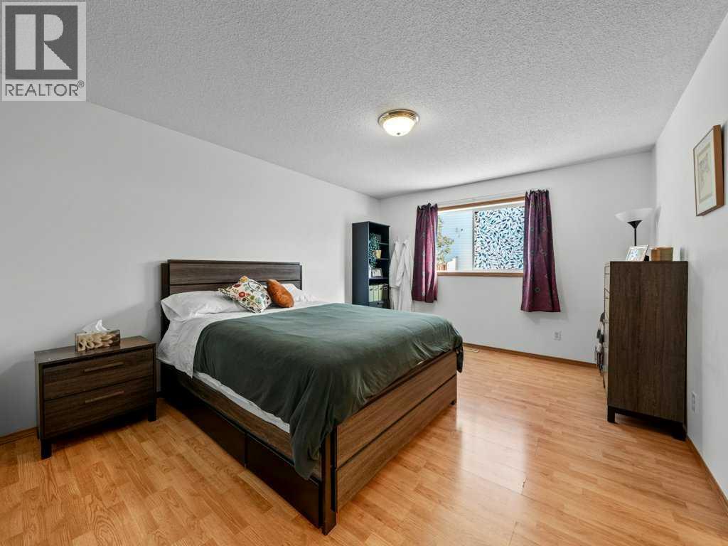 Single Family House Bi-level for Sale in  Arbour Stone Rise NW Arbour Lake Calgary 