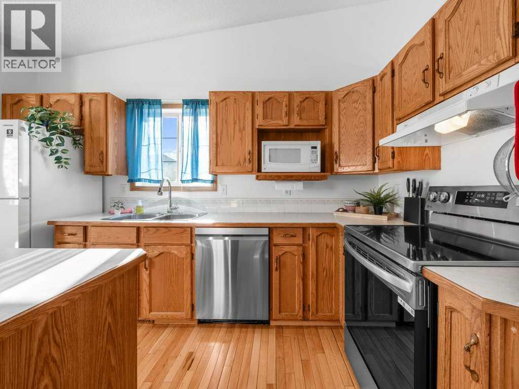 Single Family House Bi-level for Sale in  Arbour Stone Rise NW Arbour Lake Calgary 