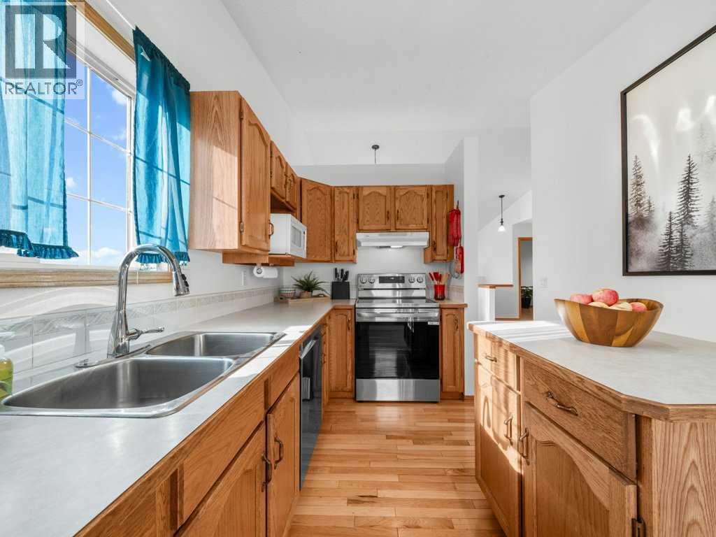 Single Family House Bi-level for Sale in  Arbour Stone Rise NW Arbour Lake Calgary 