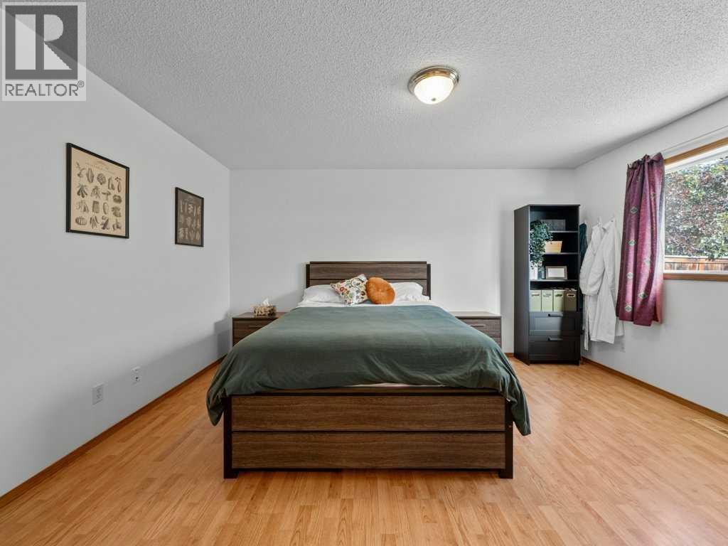 Single Family House Bi-level for Sale in  Arbour Stone Rise NW Arbour Lake Calgary 