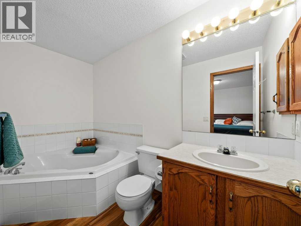 Single Family House Bi-level for Sale in  Arbour Stone Rise NW Arbour Lake Calgary 