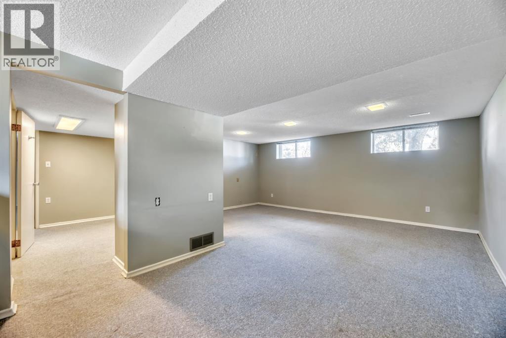 Single Family House Bi-level for Sale in  Brazeau Crescent SW Braeside Calgary 