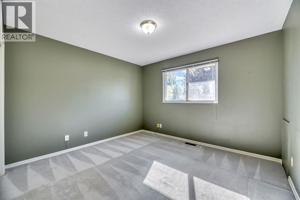 Single Family House Bi-level for Sale in  Brazeau Crescent SW Braeside Calgary 