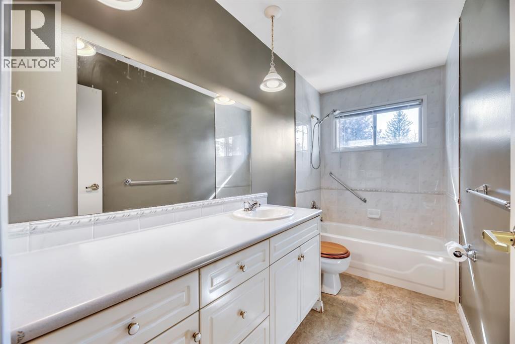 Single Family House Bi-level for Sale in  Brazeau Crescent SW Braeside Calgary 