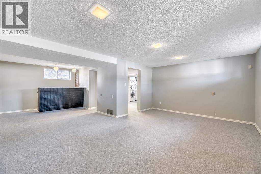 Single Family House Bi-level for Sale in  Brazeau Crescent SW Braeside Calgary 