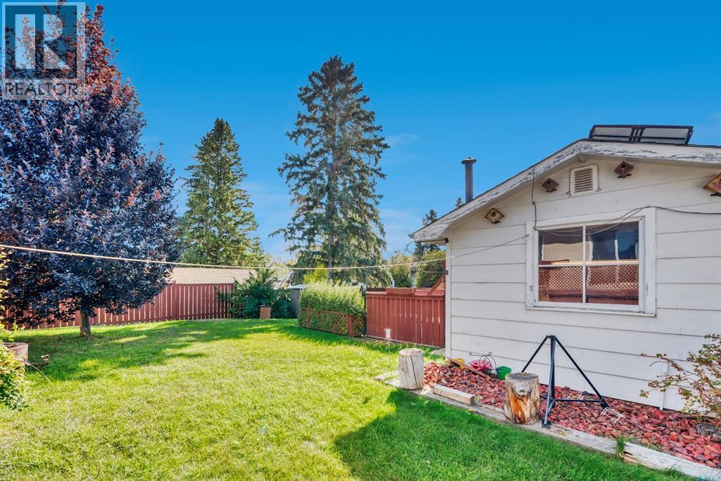 Single Family House Bi-level for Sale in  Brazeau Crescent SW Braeside Calgary 