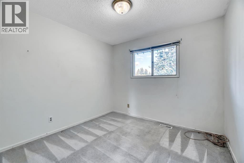 Single Family House Bi-level for Sale in  Brazeau Crescent SW Braeside Calgary 