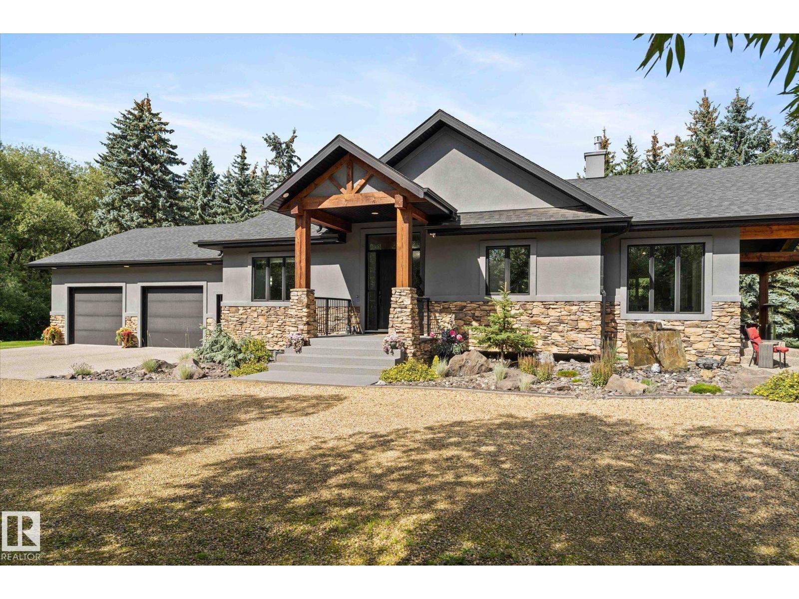 Front exterior and driveway of 231 75 ST SW Ellerslie Edmonton acreage