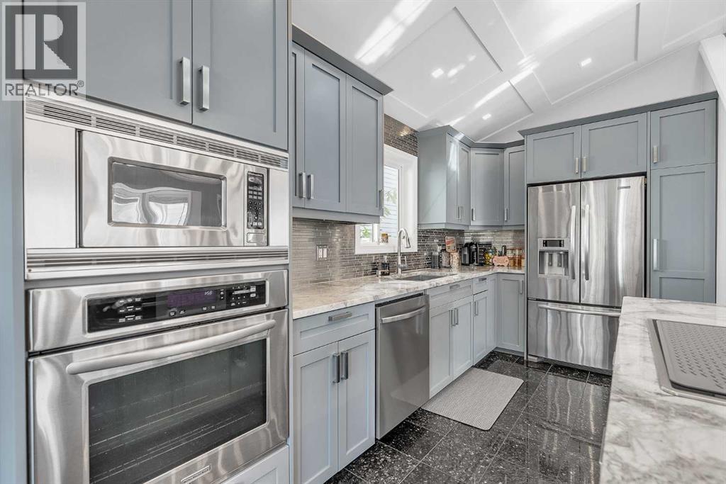 Single Family House 4 Level for Sale in  MT. Aberdeen Close SE McKenzie Lake Calgary 