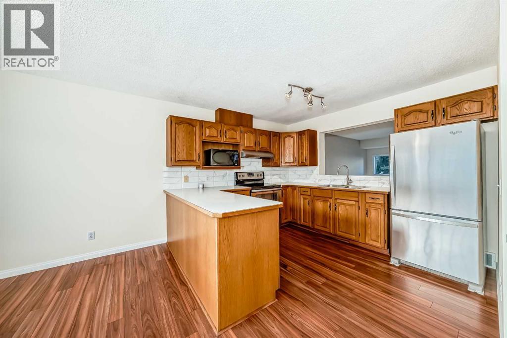 Single Family House 4 Level for Sale in  Kingsland Court SW Kingsland Calgary 