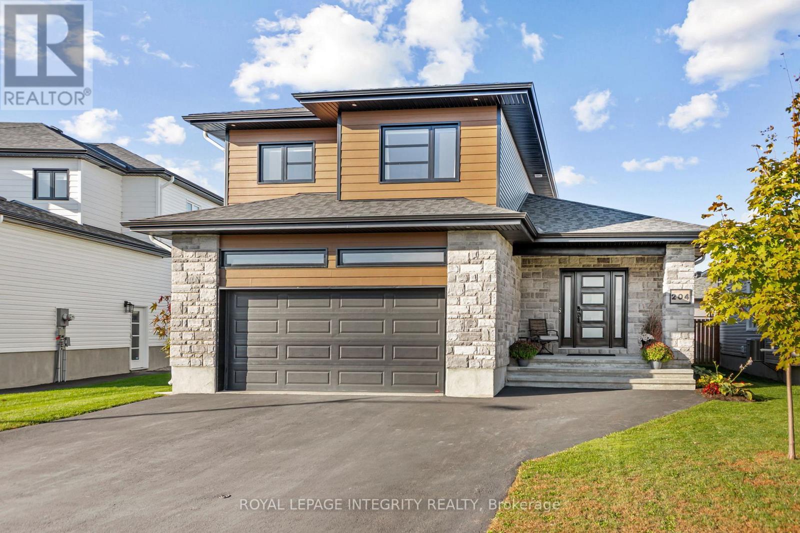 Large driveway, finished and heated garage