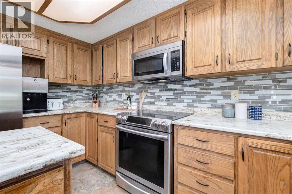 Single Family House for Sale in  Canterbury Court SW Canyon Meadows Calgary 