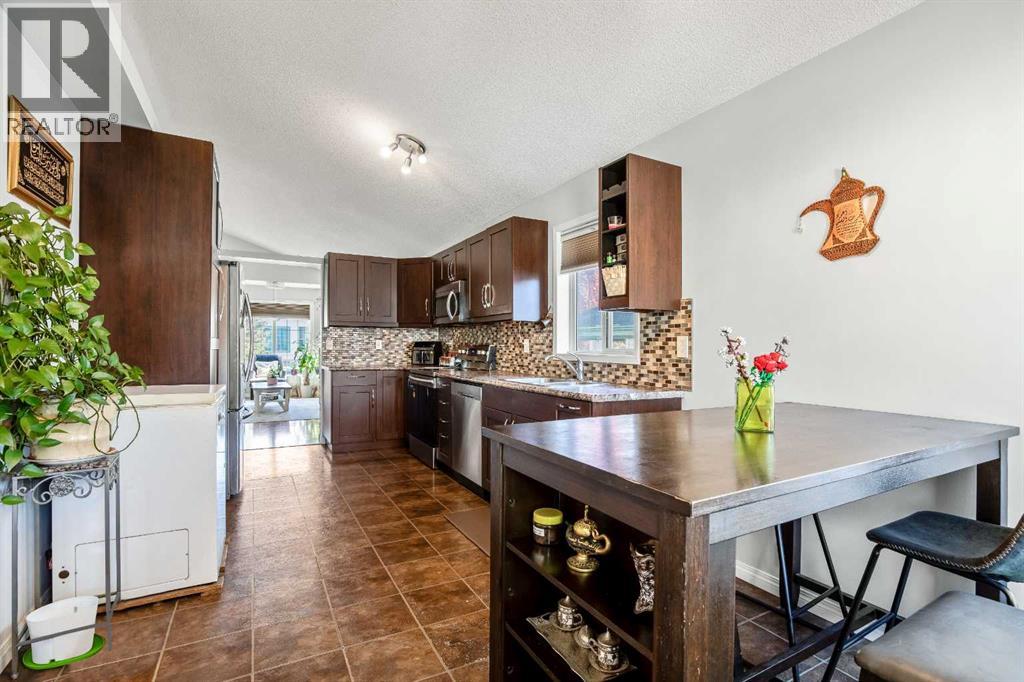 Single Family House Bi-level for Sale in  Mt Allan Circle SE McKenzie Lake Calgary 