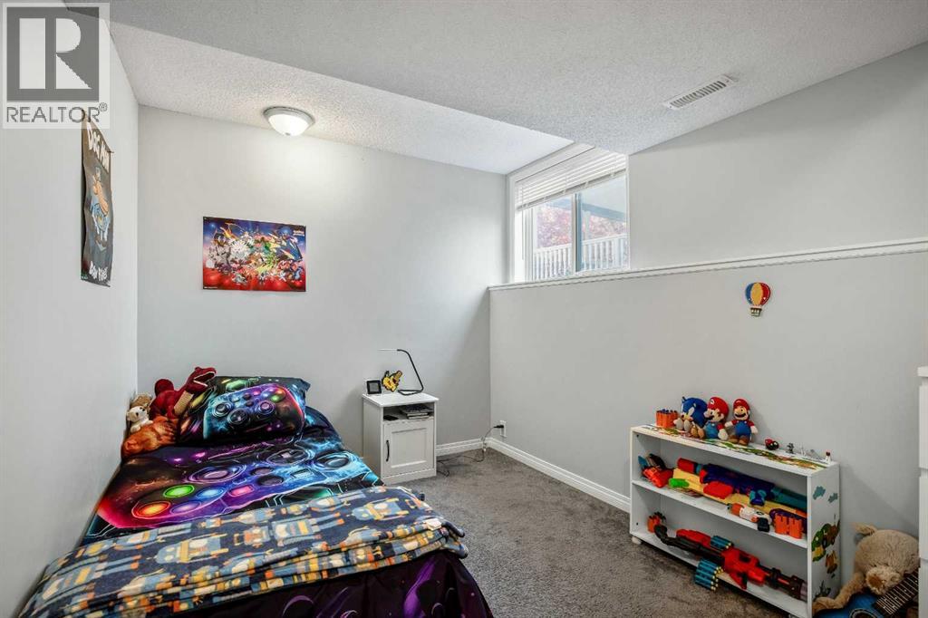 Single Family House Bi-level for Sale in  Mt Allan Circle SE McKenzie Lake Calgary 