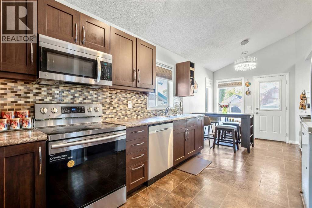 Single Family House Bi-level for Sale in  Mt Allan Circle SE McKenzie Lake Calgary 
