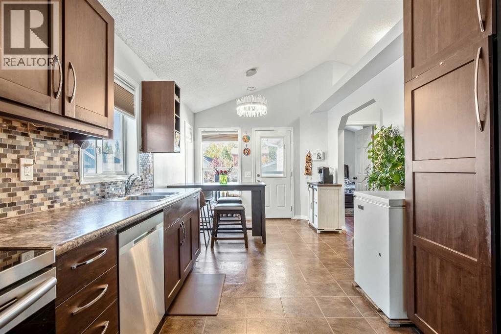 Single Family House Bi-level for Sale in  Mt Allan Circle SE McKenzie Lake Calgary 