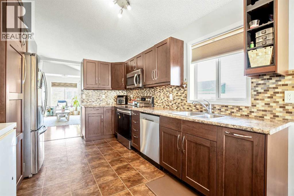 Single Family House Bi-level for Sale in  Mt Allan Circle SE McKenzie Lake Calgary 