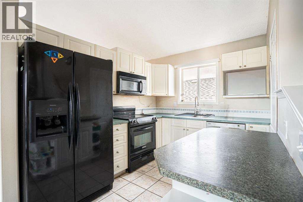 Single Family House 4 Level for Sale in  Laguna Way NE Monterey Park Calgary 