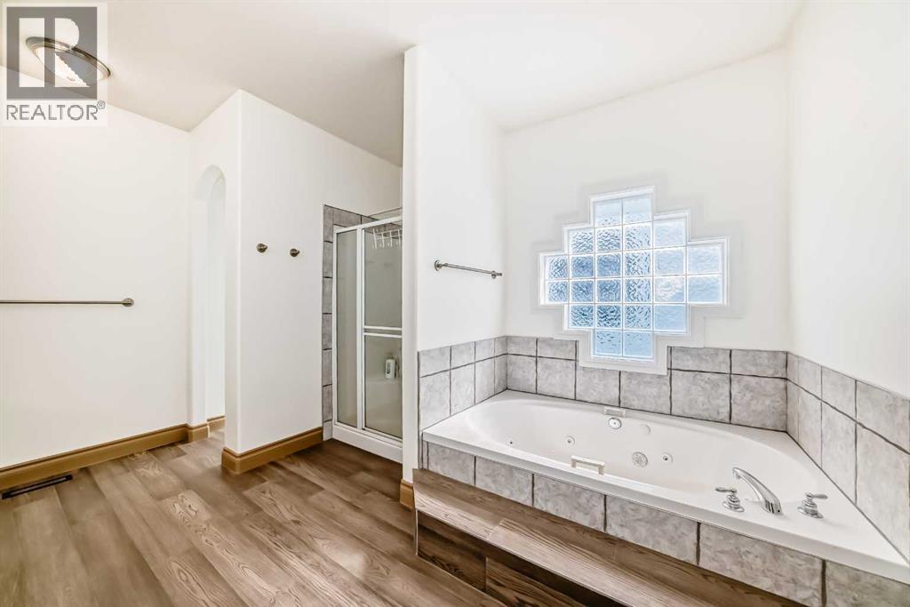 Single Family House Bungalow for Sale in  Simcoe Gate SW Signal Hill Calgary 