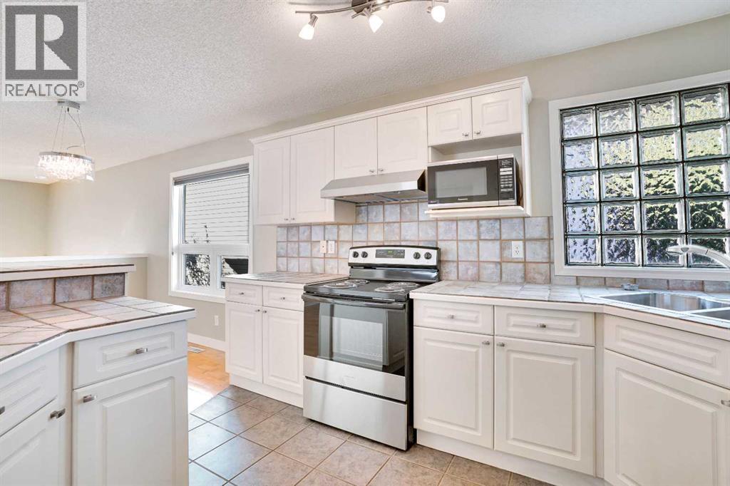 Single Family House 3 Level for Sale in  Arbour Grove Close NW Arbour Lake Calgary 