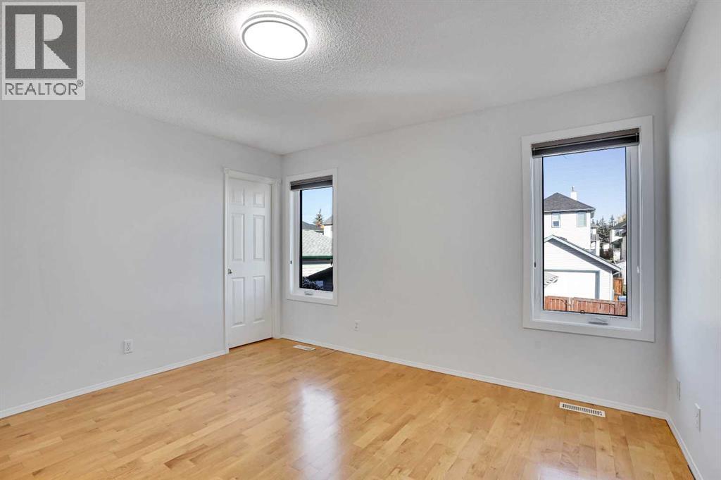 Single Family House 3 Level for Sale in  Arbour Grove Close NW Arbour Lake Calgary 