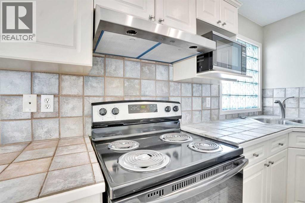 Single Family House 3 Level for Sale in  Arbour Grove Close NW Arbour Lake Calgary 
