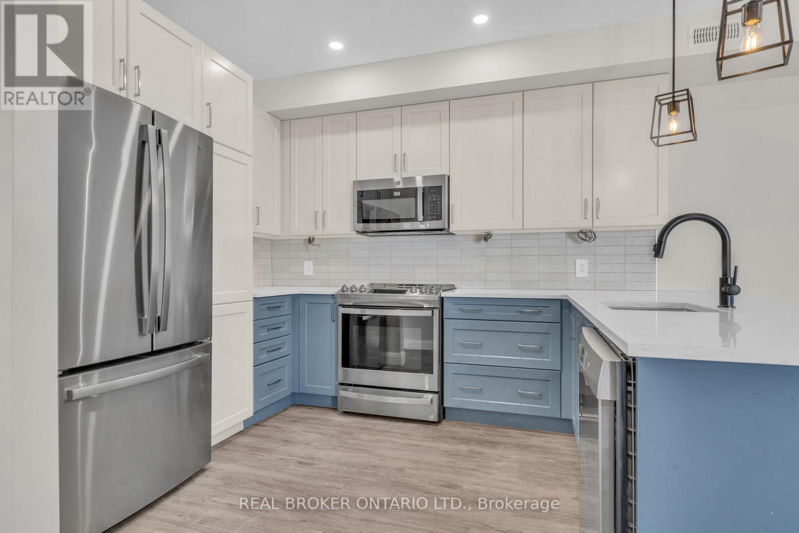 2 Tone Kitchen Cabinetry with Quartz Countertops