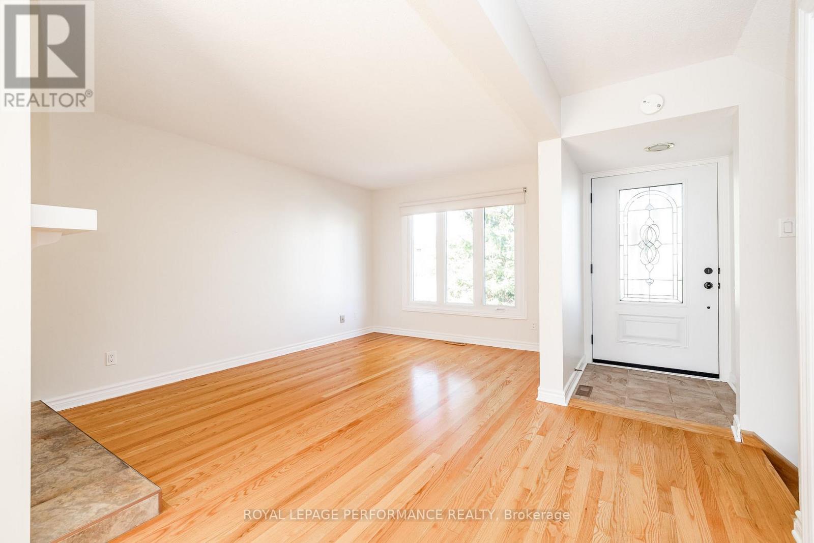 Foyer with powder room opens to living room