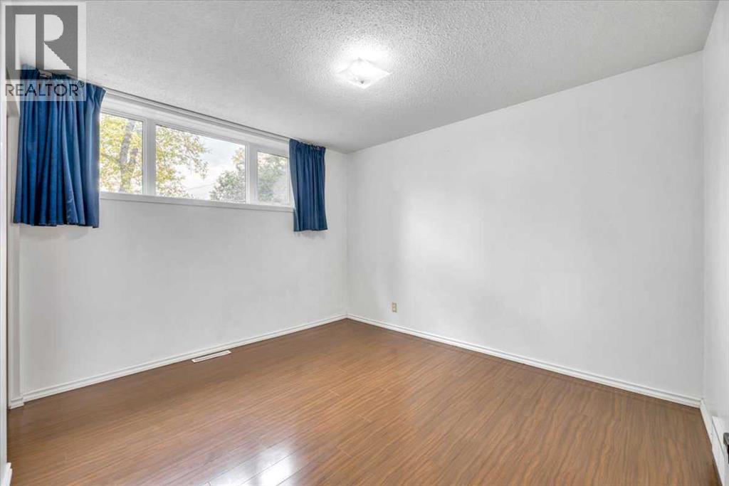 Single Family House Bi-level for Sale in  Brisebois Drive NW Brentwood Calgary 