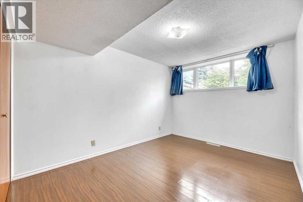 Single Family House Bi-level for Sale in  Brisebois Drive NW Brentwood Calgary 