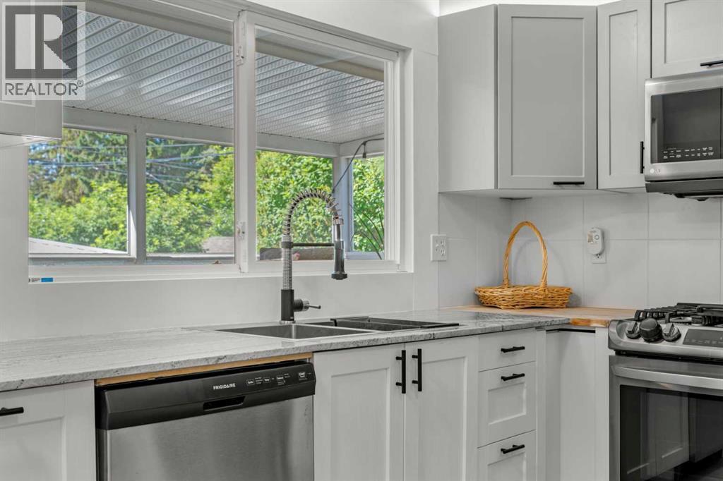 Single Family House Bi-level for Sale in  Bearspaw Drive NW Brentwood Calgary 