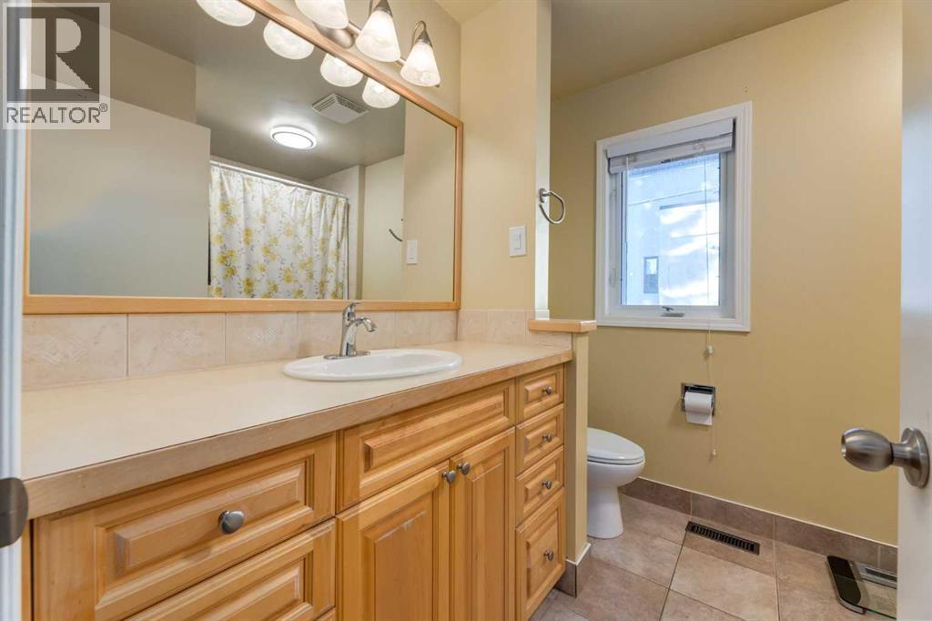 Single Family House 4 Level for Sale in  Lake Emerald Crescent SE Lake Bonavista Calgary 