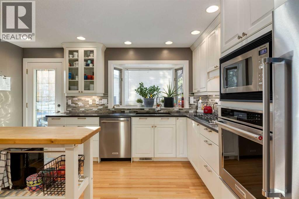 Single Family House 4 Level for Sale in  Lake Emerald Crescent SE Lake Bonavista Calgary 