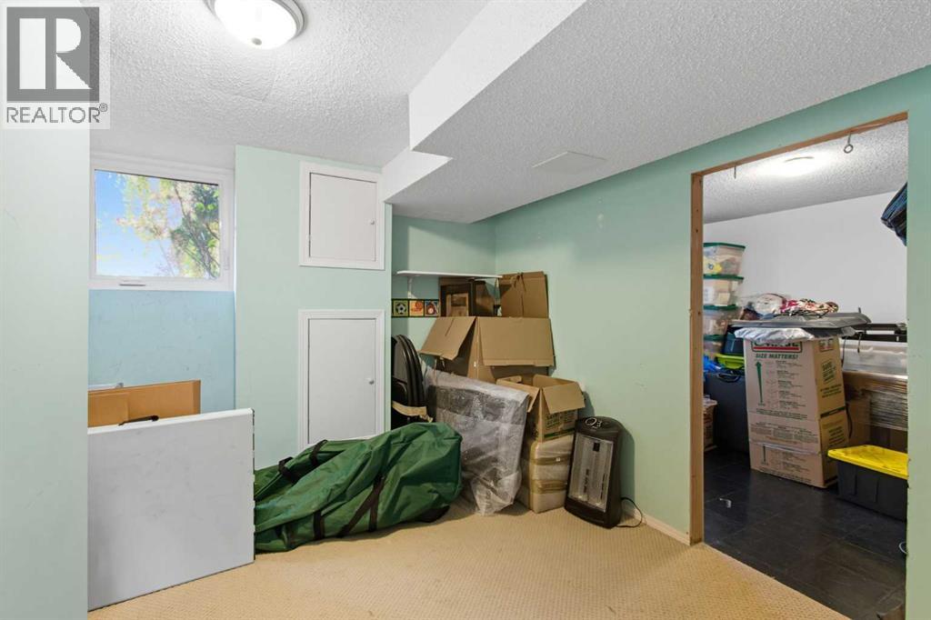 Single Family House Bi-level for Sale in  Brazeau Crescent SW Braeside Calgary 