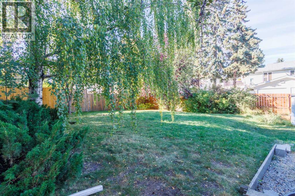 Single Family House Bi-level for Sale in  Brazeau Crescent SW Braeside Calgary 