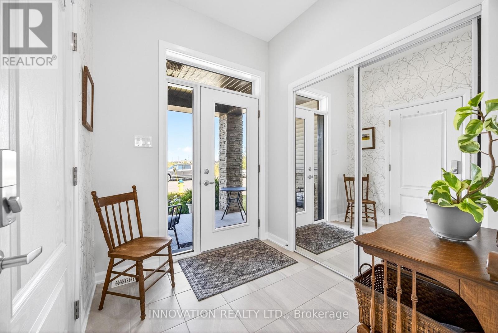 Kitchen with steel appliances and quartz counters