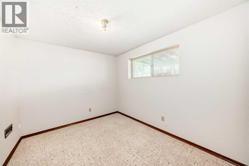 Single Family House Bi-level for Sale in  Barron Drive NW Brentwood Calgary 