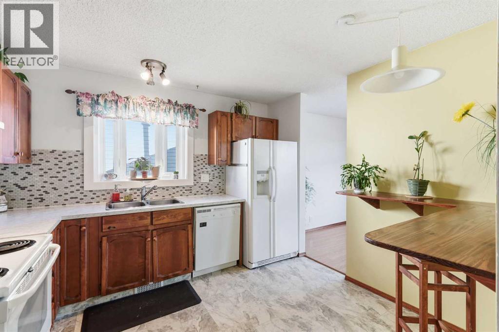 Single Family House Bi-level for Sale in  Macewan Glen Road NW MacEwan Glen Calgary 